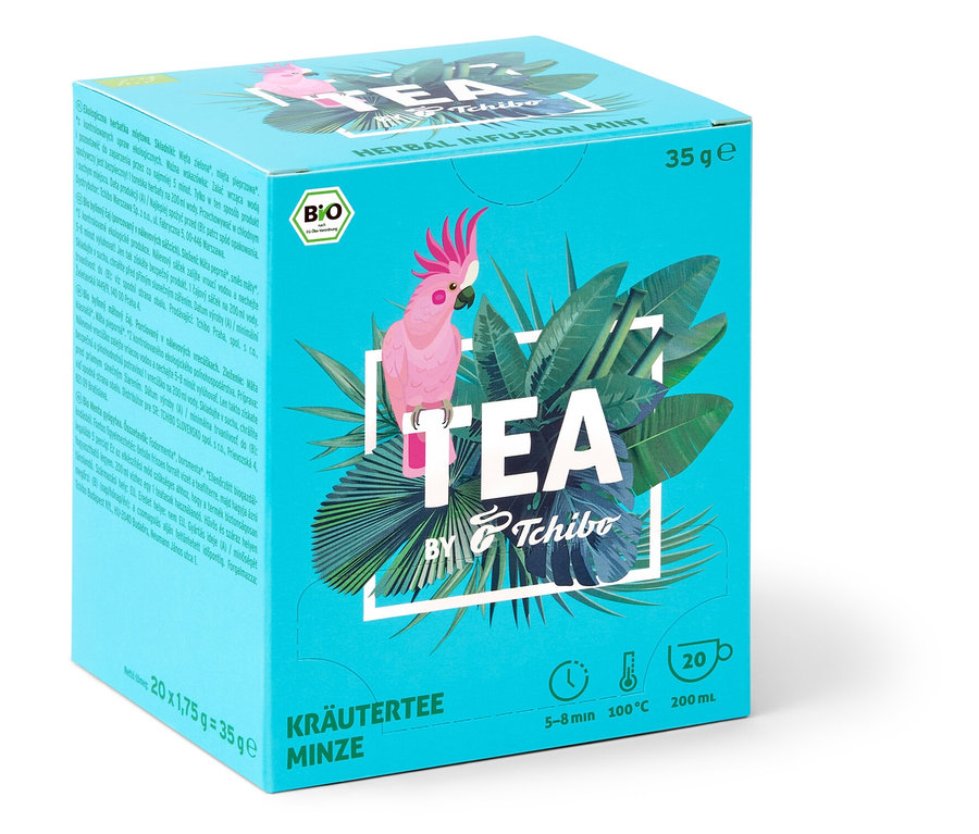 Packung TEA by Tchibo Bio Kräutertee Minze mit Kakadu und tropischen Blättern.