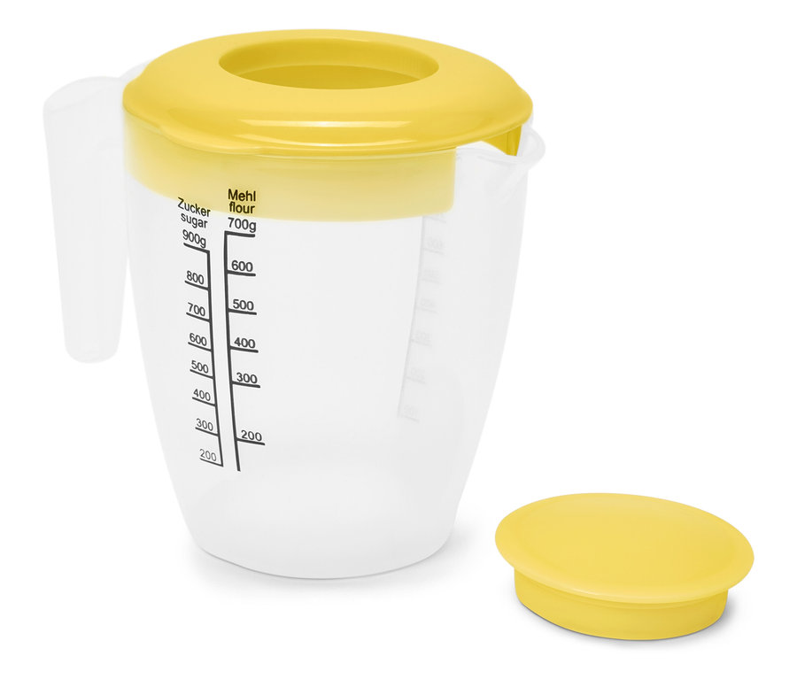 Ein transparenter Messbecher mit gelbem Deckel und Messskala.