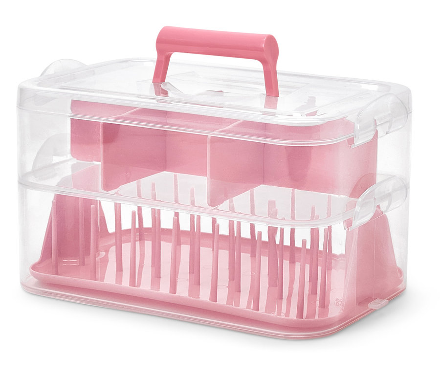 Rosa Utensilienbox aus Kunststoff.