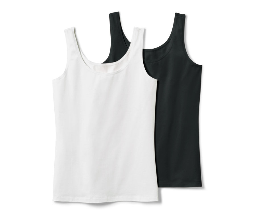 Zwei Hemdchen, eines in Weiß und eines in Schwarz.