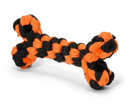 Ein schwarz-oranges Hundespielzeug in Knochenform.
