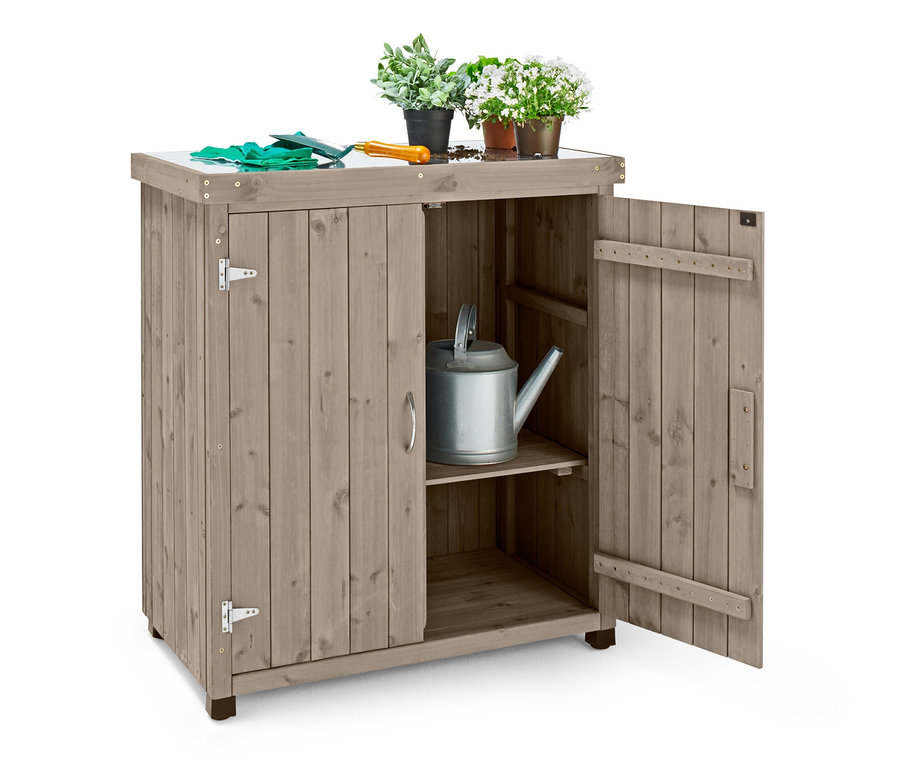 Geöffneter Kleiner Gartenschrank »Jonte« mit verzinkter Arbeitsfläche, auf der sich Topfblumen und Gartenhandschuhe befinden.