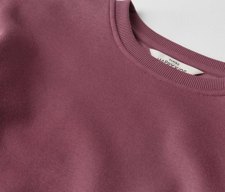 Detailansicht eines Kinder-Sweatkleids.