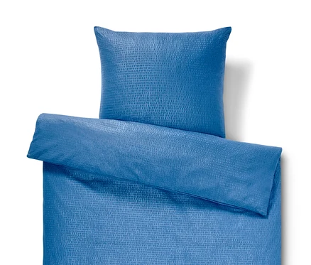 Blaue Seersucker-Bettwäsche Normalgröße mit Kissen.