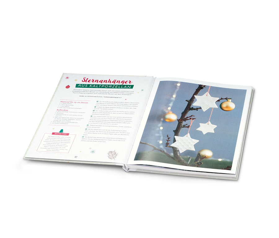 Aufgeschlagenes Buch »Weihnachtsbasteln«, abgebildet sind Sterne und goldene Kugeln.