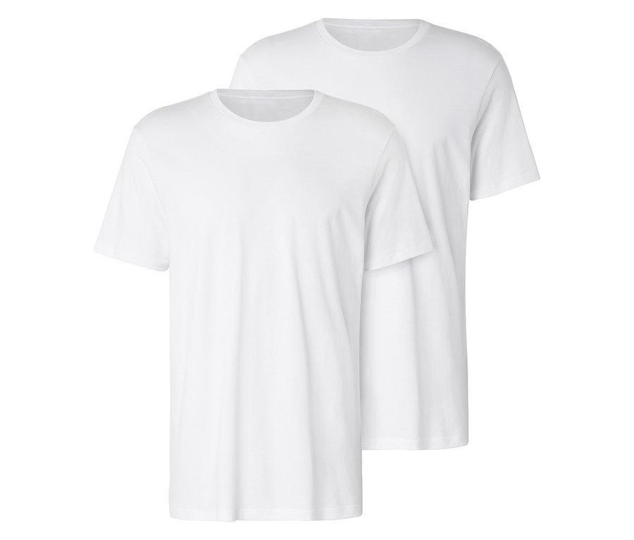 Zwei weiße T-Shirts liegen übereinander.