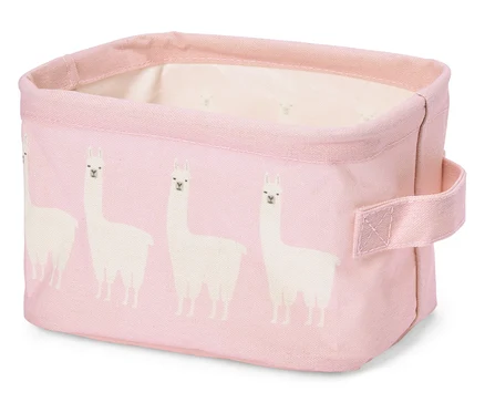 Rosa Stoffbox mit weißen Lama-Motiven und Tragegriff.
