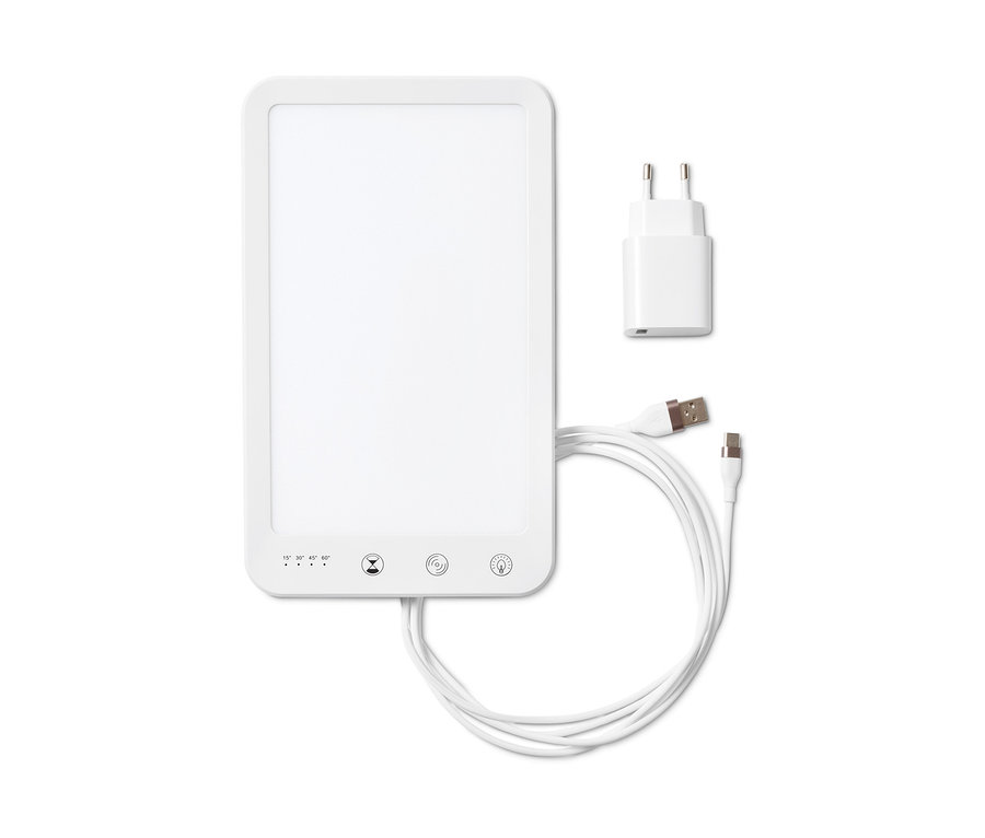 Weiße Tageslichtlampe mit Netzteil und Kabel.