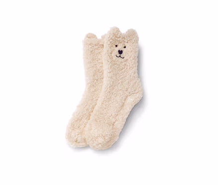 Zwei Teddy-Kuschelsocken liegen nebeneinander.