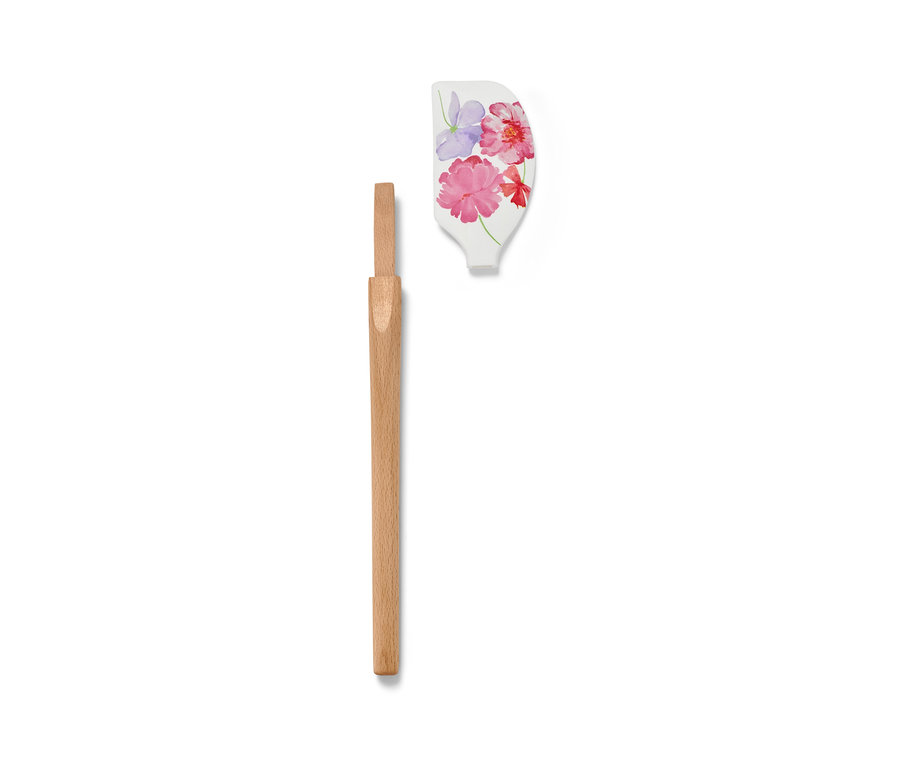 Ein zerlegter Teigschaber mit Blumenmuster und Holzgriff.