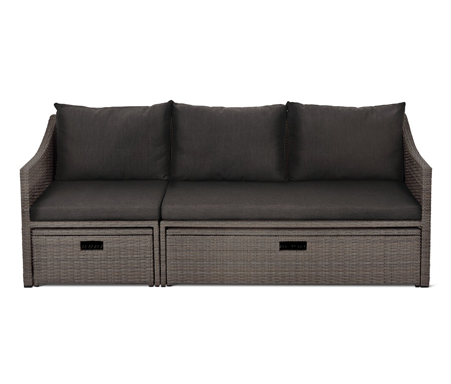 Graues Auszieh-Schlafsofa »Thore« mit Stauraum und grauen Kissen.