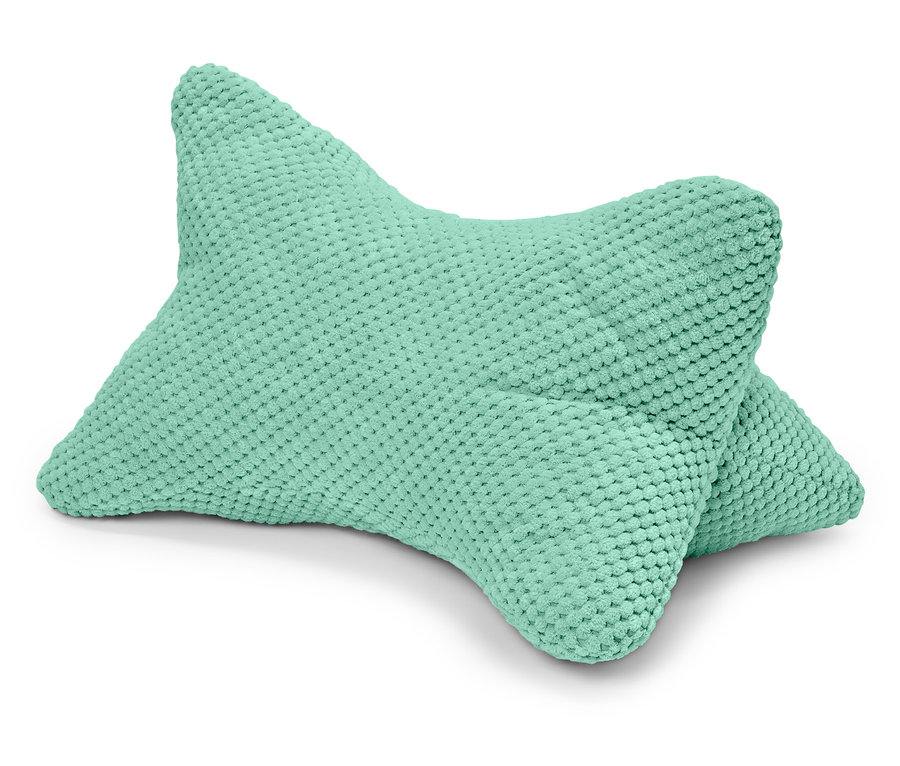 Ein mintgrünes Lesekissen liegt auf einem weißen Hintergrund.