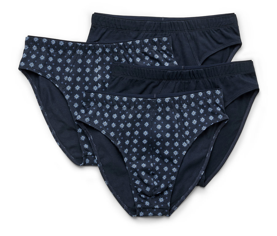 Drei marineblaue Herrenslips liegen übereinander, zwei davon mit blauem Blumenmuster.