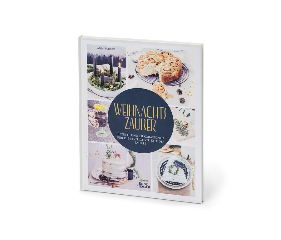 Buch "Weihnachtszauber" mit Fotos von Weihnachtsdekorationen und Speisen.