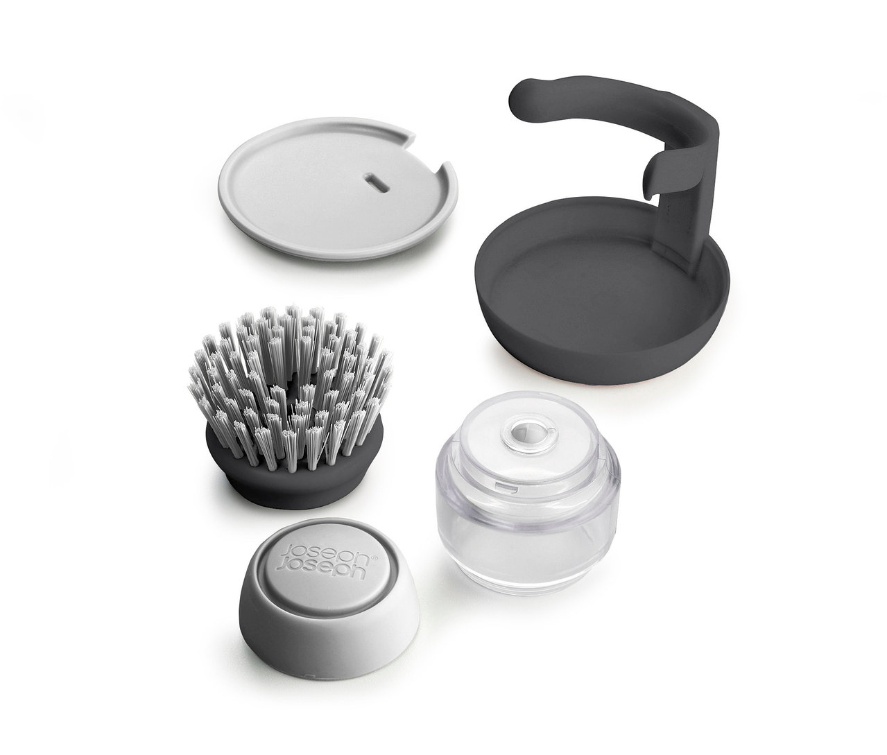 Ein zerlegtes graues und weißes Joseph Joseph Spülbürsten-Set.