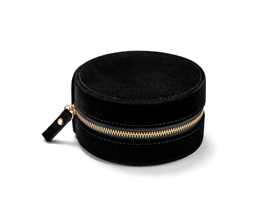Eine kleine, runde, schwarze Schmuckdose mit goldenem Reißverschluss.