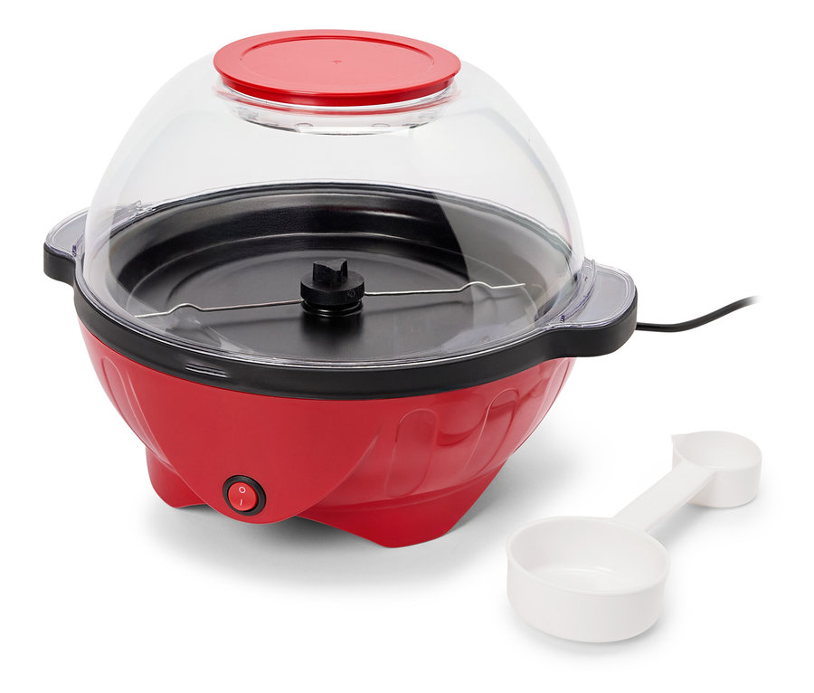 Roter Popcorn-Maker mit Messlöffel.