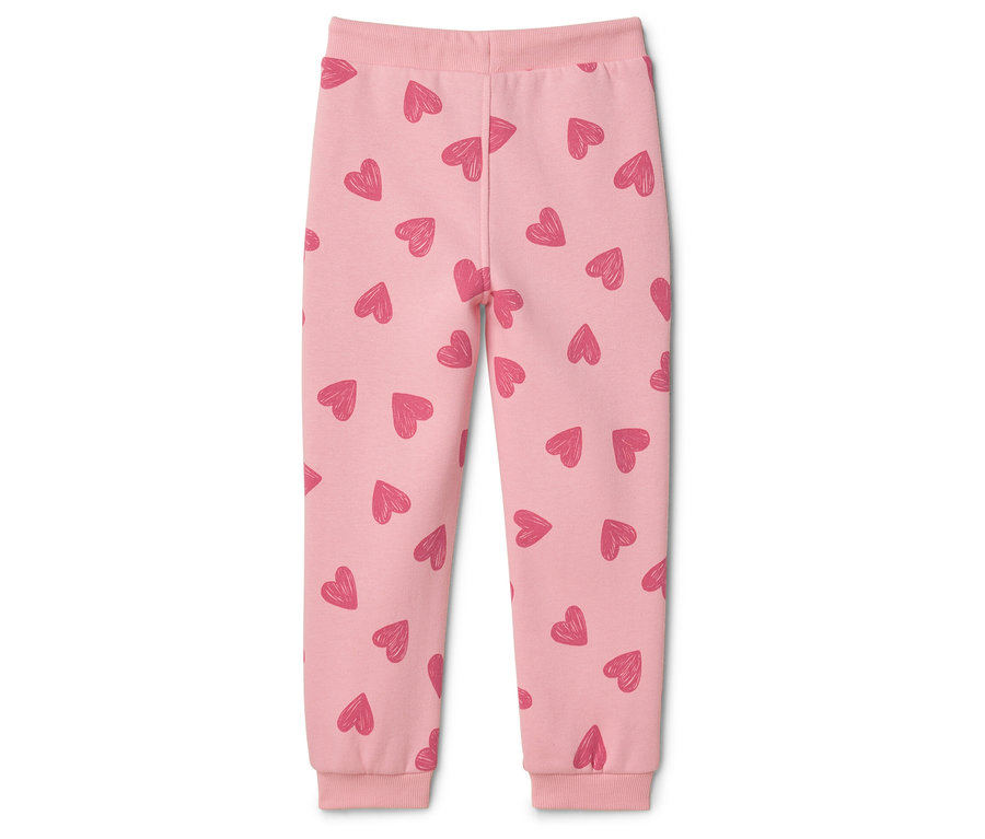 Rosa Kinderhose mit Herzmuster.