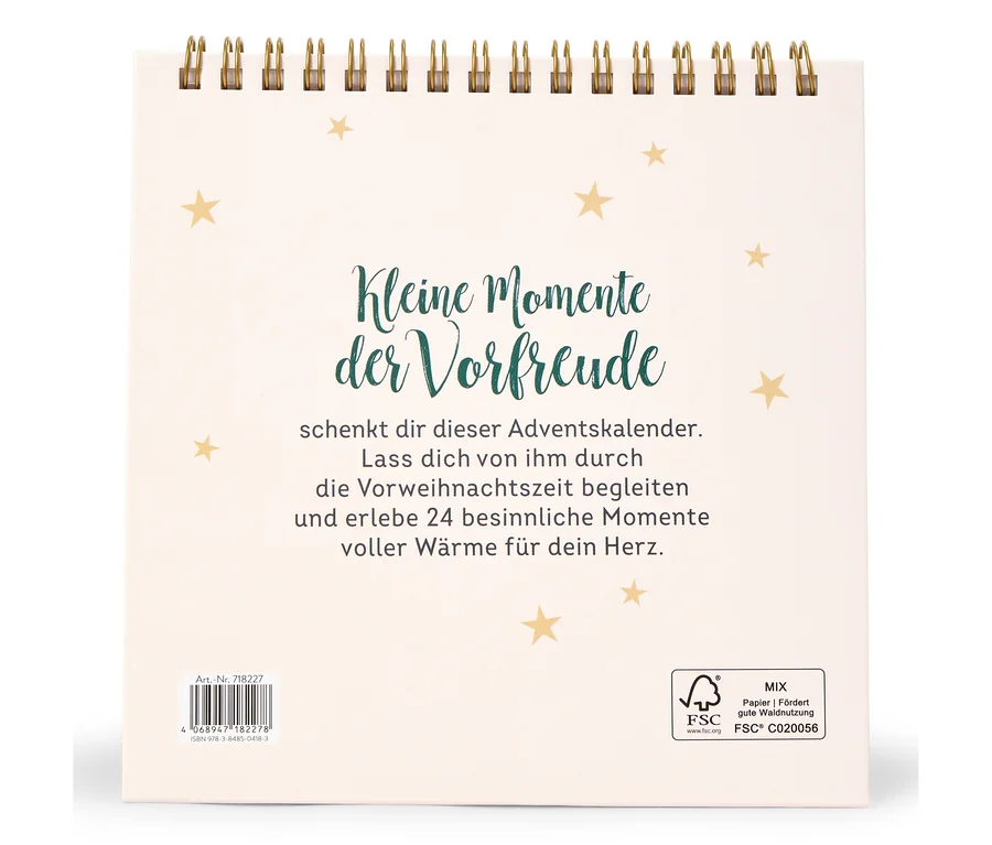 Weißer Kalender mit der Aufschrift "Kleine Momente der Vorfreude" und goldenen Sternen.