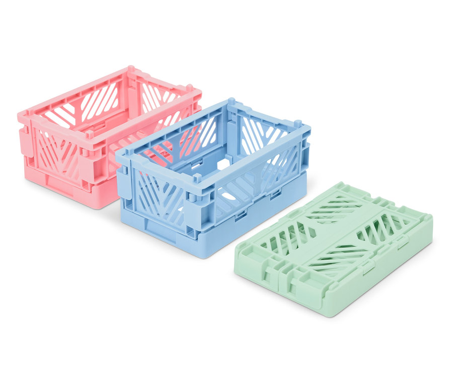 Drei faltbare Kunststoffboxen: rosa, blau und grün.