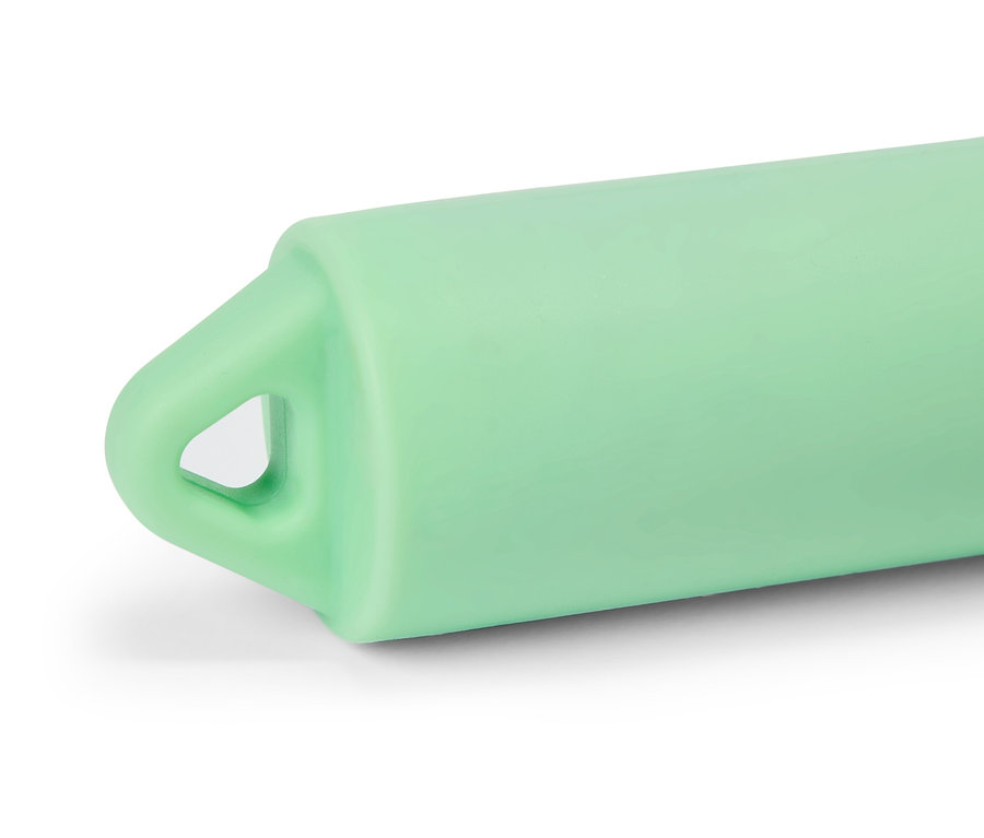 Nahaufnahme eines hellgrünen Gegenstandes mit einer dreieckigen Öffnung an der Seite.