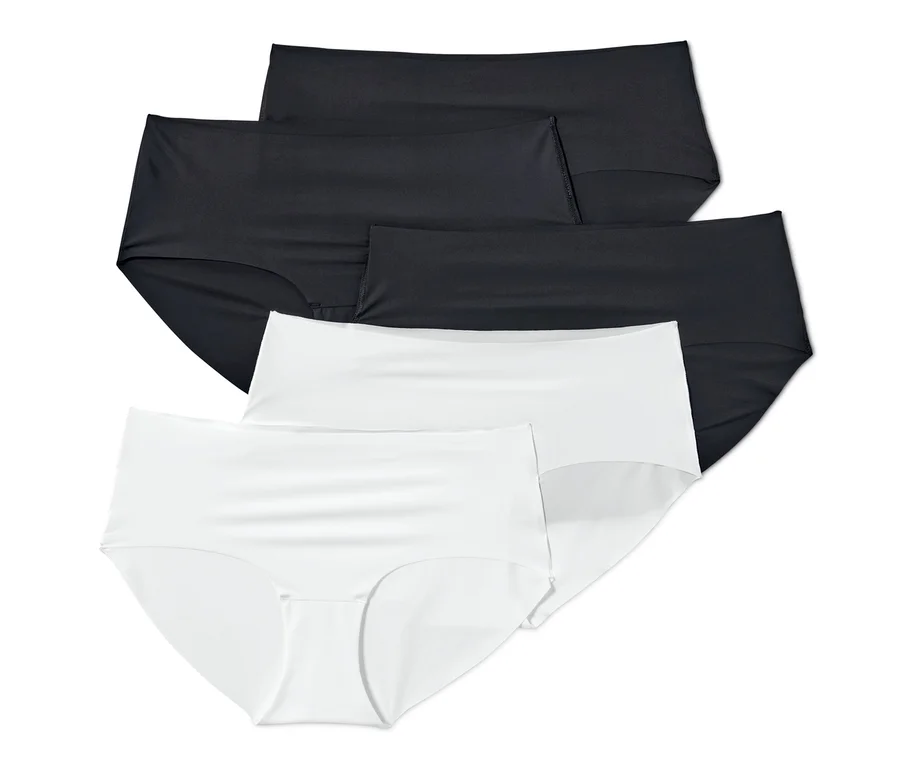 Auf dem Bild sind fünf Magic-Cut-Pantys, weiß und schwarz, übereinander angeordnet.