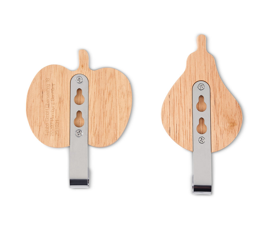 Zwei Wandhaken in Apfel- und Birnenform.