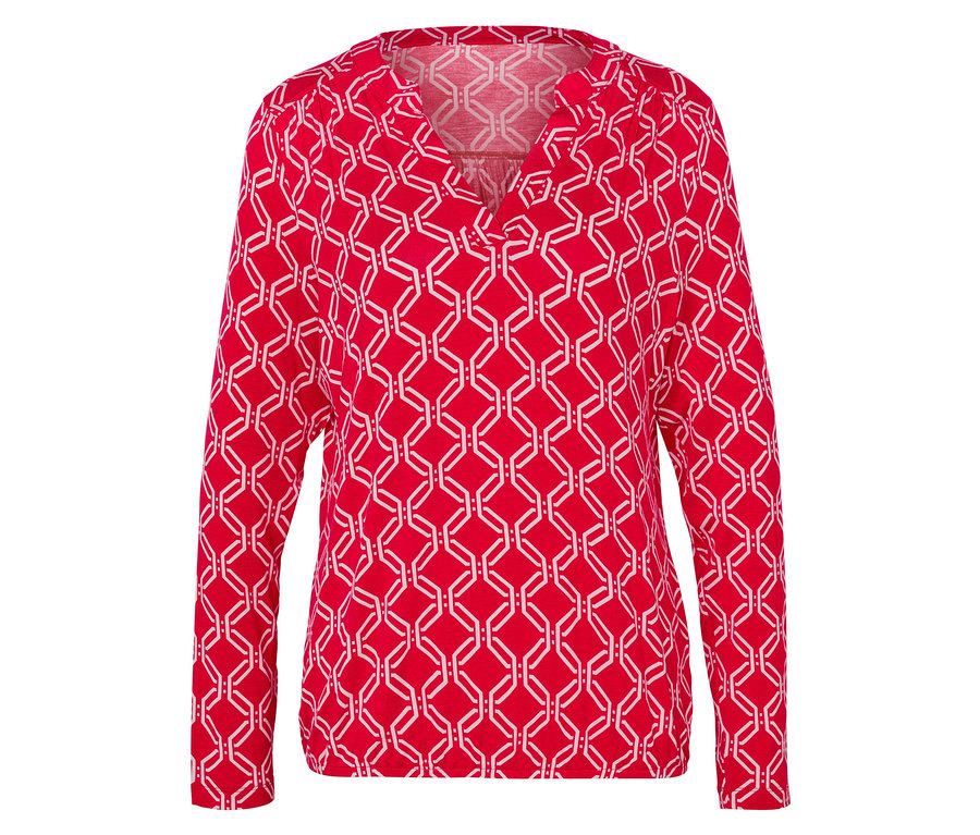 Rote, langärmlige Bluse mit weißem geometrischem Muster.