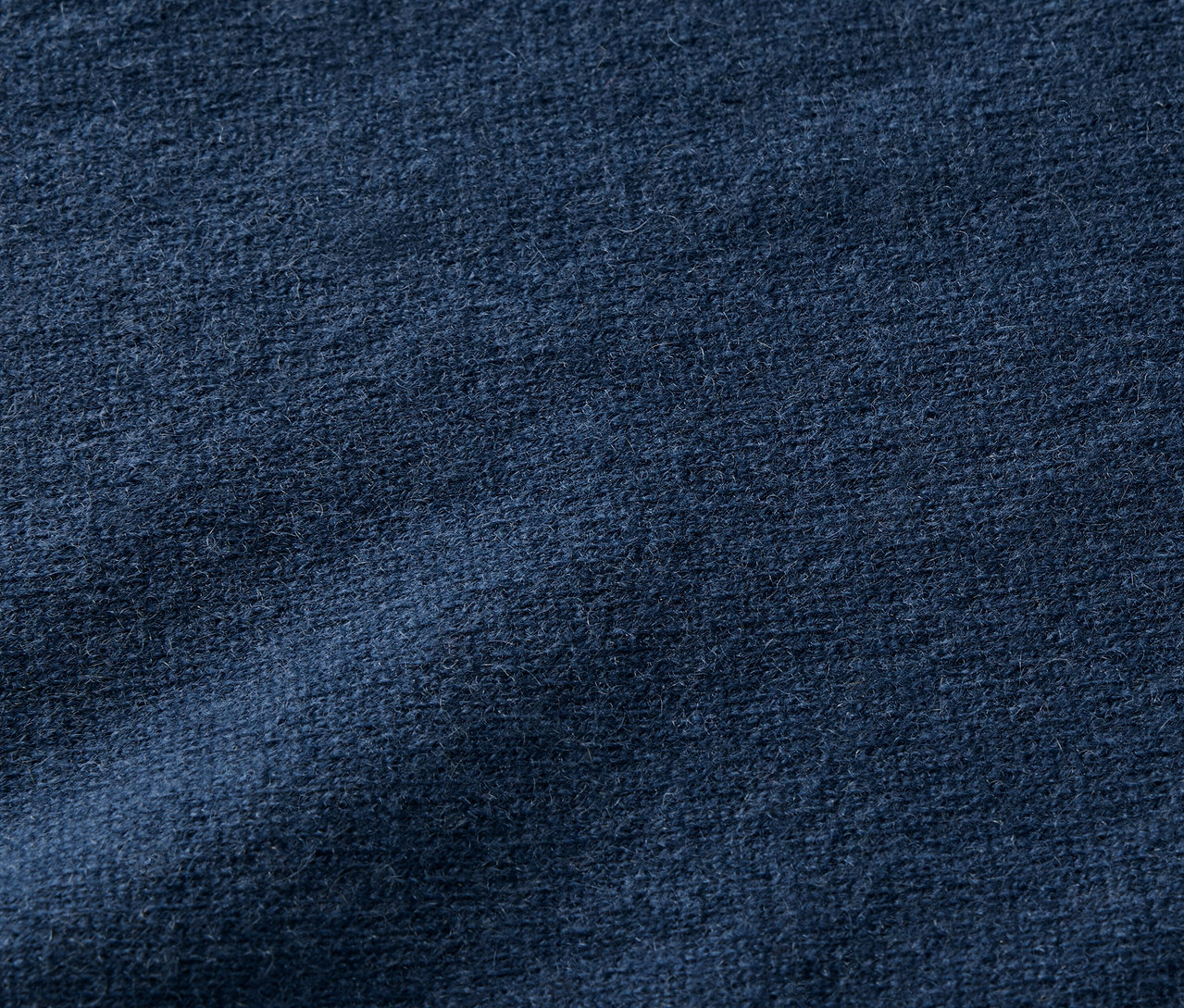 Textur eines dunkelblauen Stoffes.