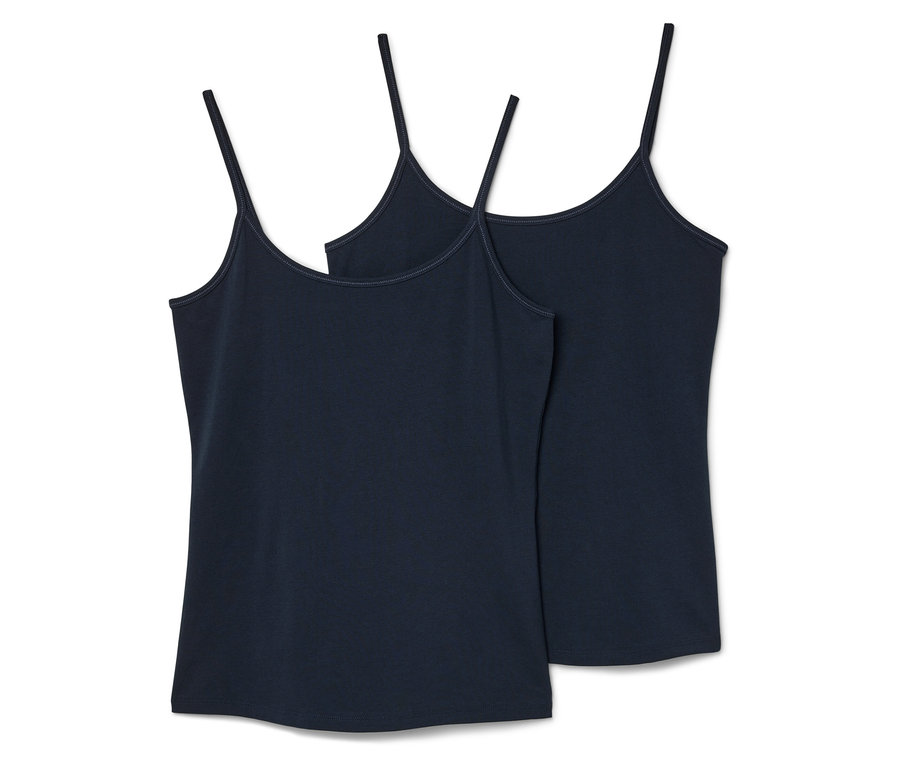 Zwei dunkelblaue Tanktops mit dünnen Trägern liegen nebeneinander.