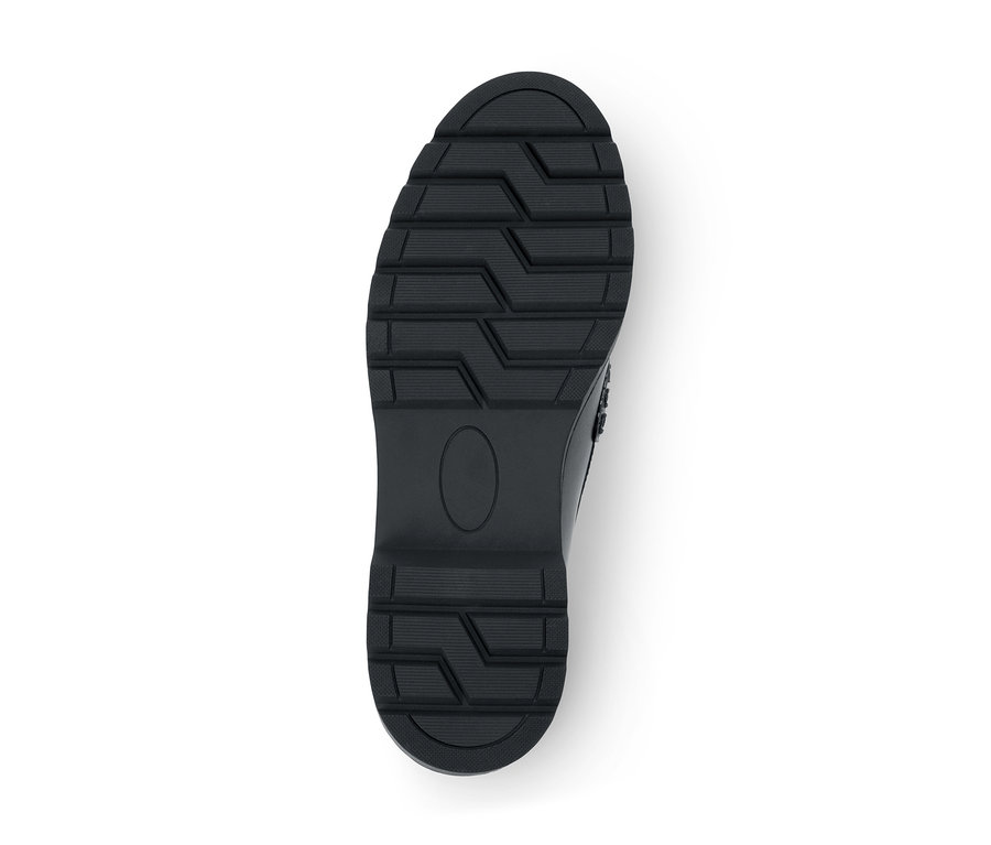 Schwarze Schuhsohle mit tiefem Profil und einem ovalen, glatten Bereich in der Mitte.