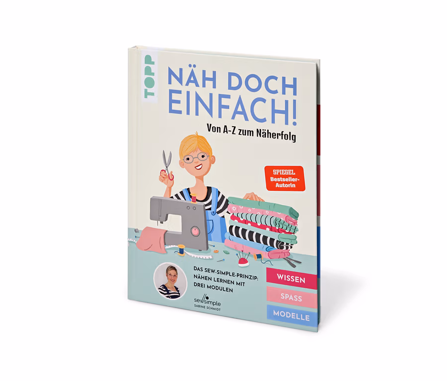 Buch »Näh doch einfach« mit Comic-Zeichnung einer Schneiderin, Nähmaschine und Stoffen.