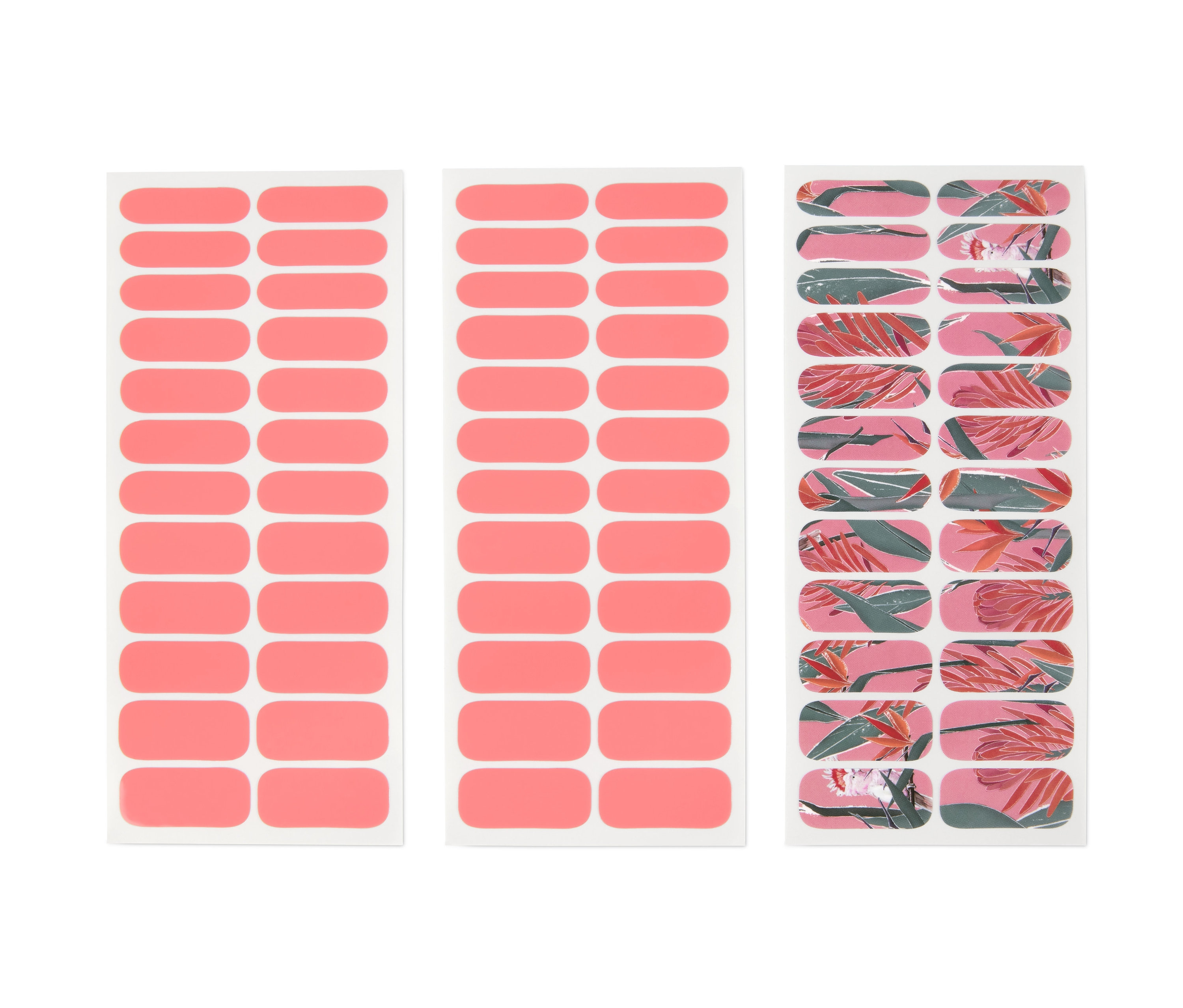 Drei Blätter selbstklebende Nagelfolien. Zwei Blätter sind einfarbig pink, ein Blatt hat einen rosa Hintergrund mit tropischen Blättern.