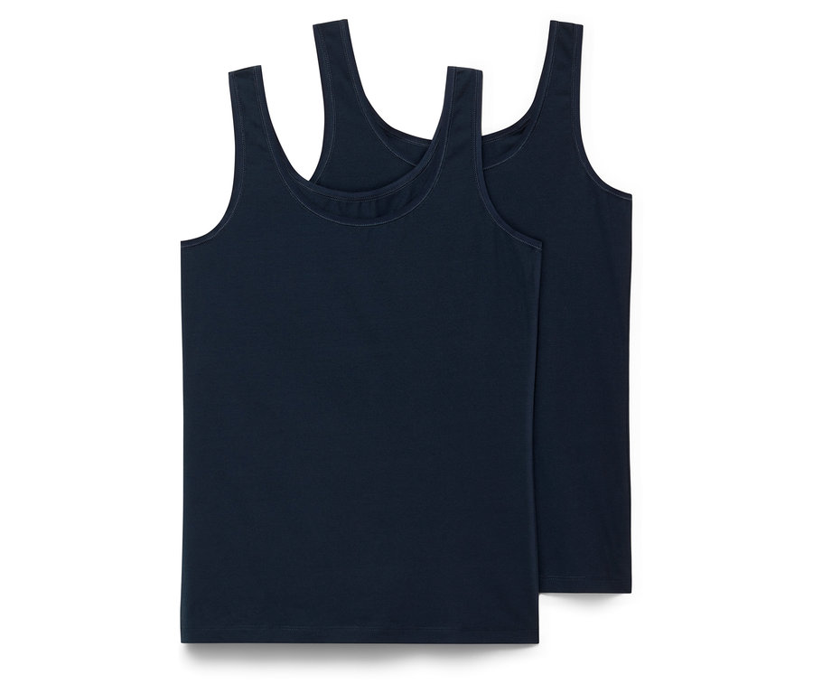 Zwei dunkelblaue Hemdchen liegen übereinander.