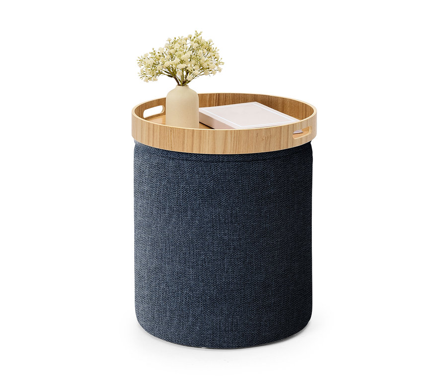 Dunkelblauer zylindrischer Aufbewahrungshocker mit einer Holzablage, auf der eine Vase mit weißen Blumen und ein Buch stehen.