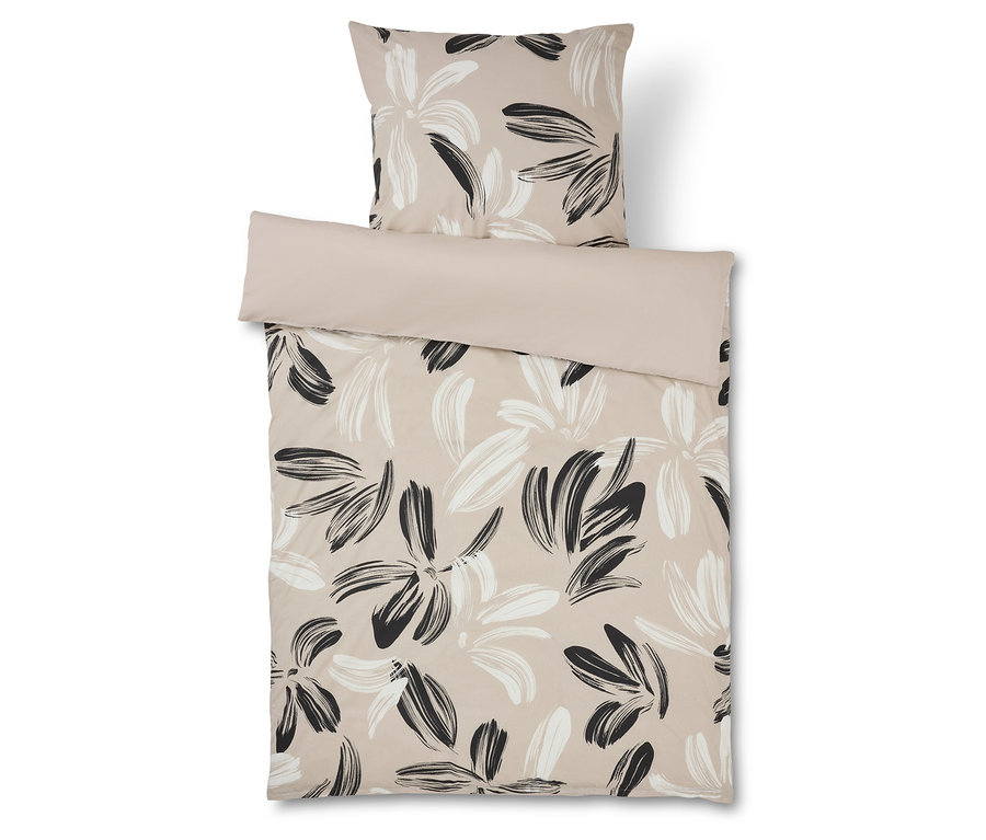 Bettwäsche mit Blumenmuster in Beige und Schwarz und passender Kissenbezug.