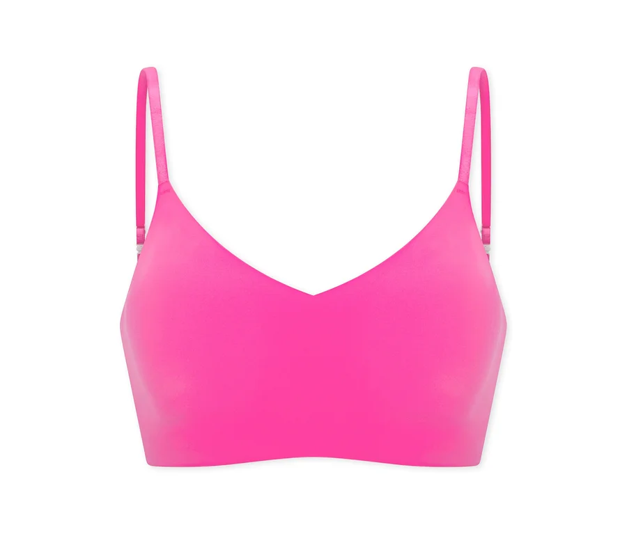 Ein pinkfarbenes SCHIESSER Invisible Bustier mit Pads auf weißem Hintergrund.