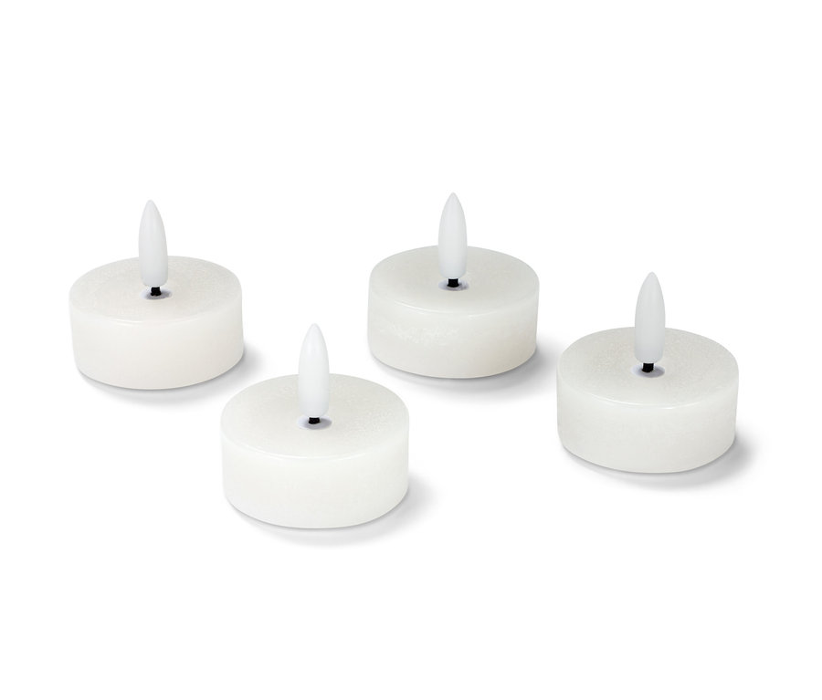 Vier weiße LED-Echtwachs-Teelichter.