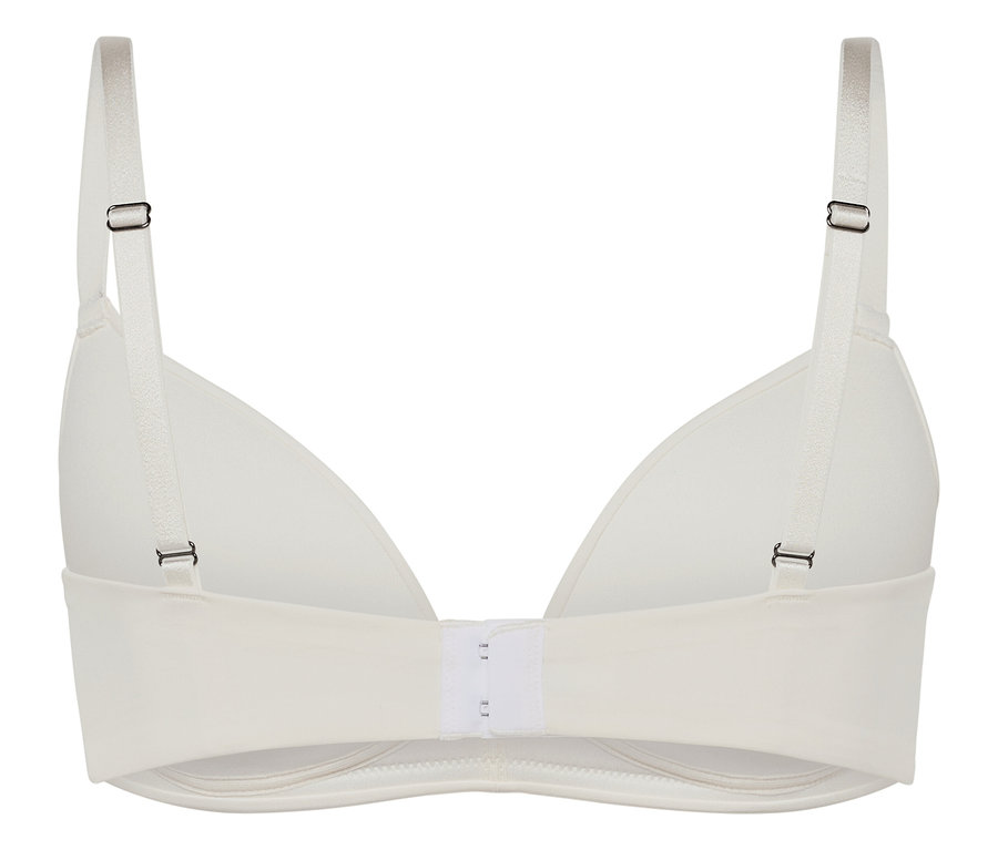 Detailansicht der Rückseite eines weißen BHs mit verstellbaren Trägern und Hakenverschluss.