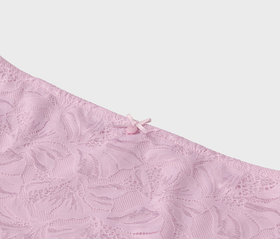 Detailaufnahme von rosafarbener Spitze mit Schleife.