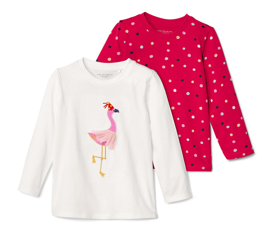 Zwei Kinder-Langarmshirts: ein weißes mit Flamingo-Motiv, ein rotes mit Punkten.
