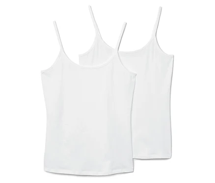 Zwei weiße Tanktops mit dünnen Trägern liegen nebeneinander.