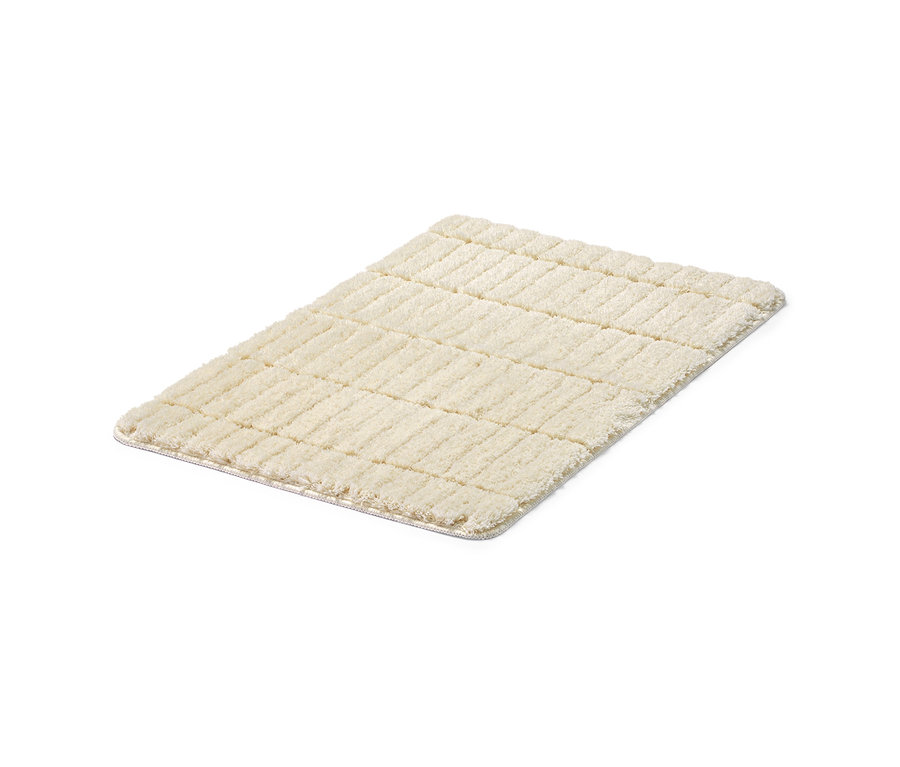 Eine offwhite Comfort-Badematte, ca. 50 x 80 cm.