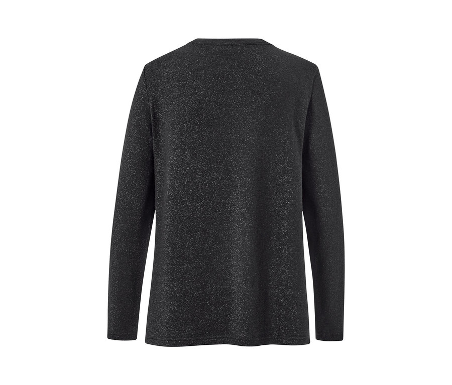Detailansicht der Rückseite eines glitzernden Blusenshirts.