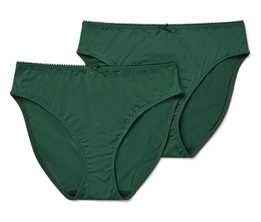 Zwei grüne Damenslips im klassischen Schnitt mit Schleife liegen auf einem weißen Hintergrund.