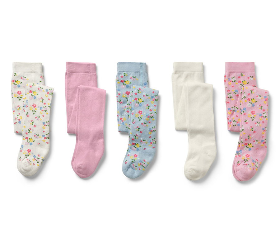 Fünf Kinder-Strumpfhosen, floral in Weiß, Rosa und Blau.