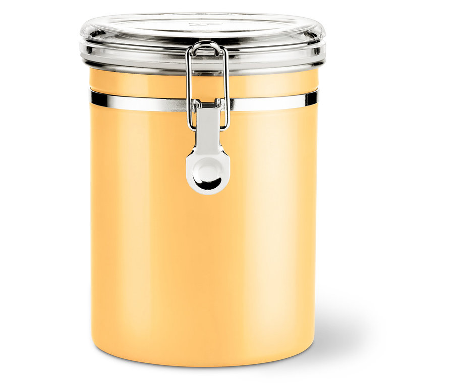 Ein gelber Vorratsbehälter mit silbernem Verschluss und transparentem Deckel steht auf einer weißen Oberfläche.