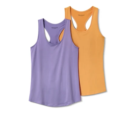 Zwei Sport-Tops, flieder und orange, liegen nebeneinander.