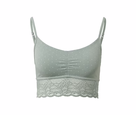 Grünes Bustier mit weißen Punkten und Spitzenrand.