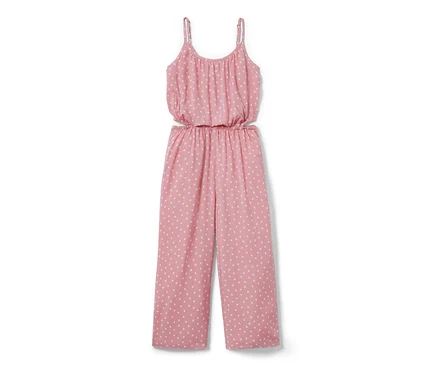 Rosa Kinder-Web-Jumpsuit in 7/8-Länge mit weißen Punkten.